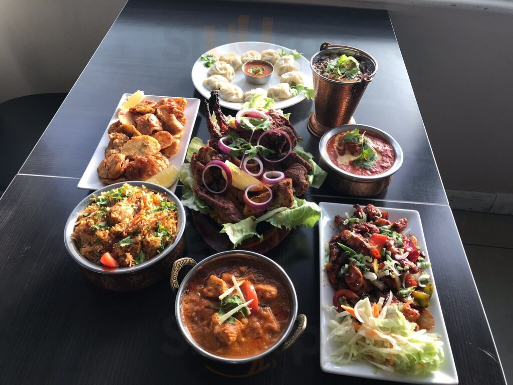Momos, tandoori grills, curries and rice served at Himalayan Club